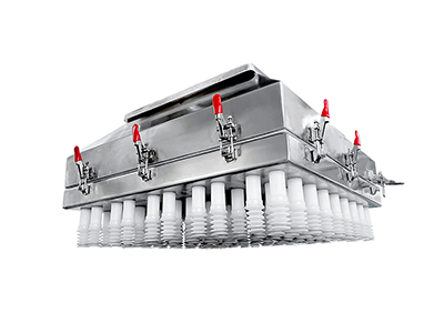 Système de transfert par aspiration à vide pour gâteaux